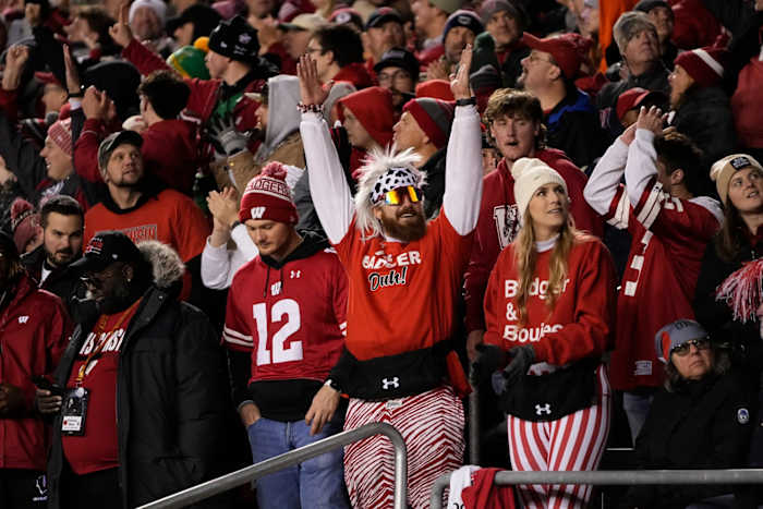 Oct 28, 2023; Madison, Wisconsin, USA; Wisconsin Badgers fans celebrate a touchdown during the second half of the NCAA football game against the Ohio State Buckeyes at Camp Randall Stadium. Ohio State won 24-10.